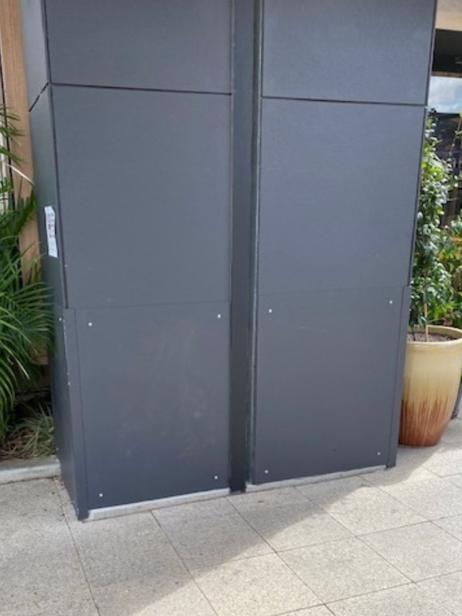 Steel protection plates installed to protect a fragile wall from shopping trolley damage